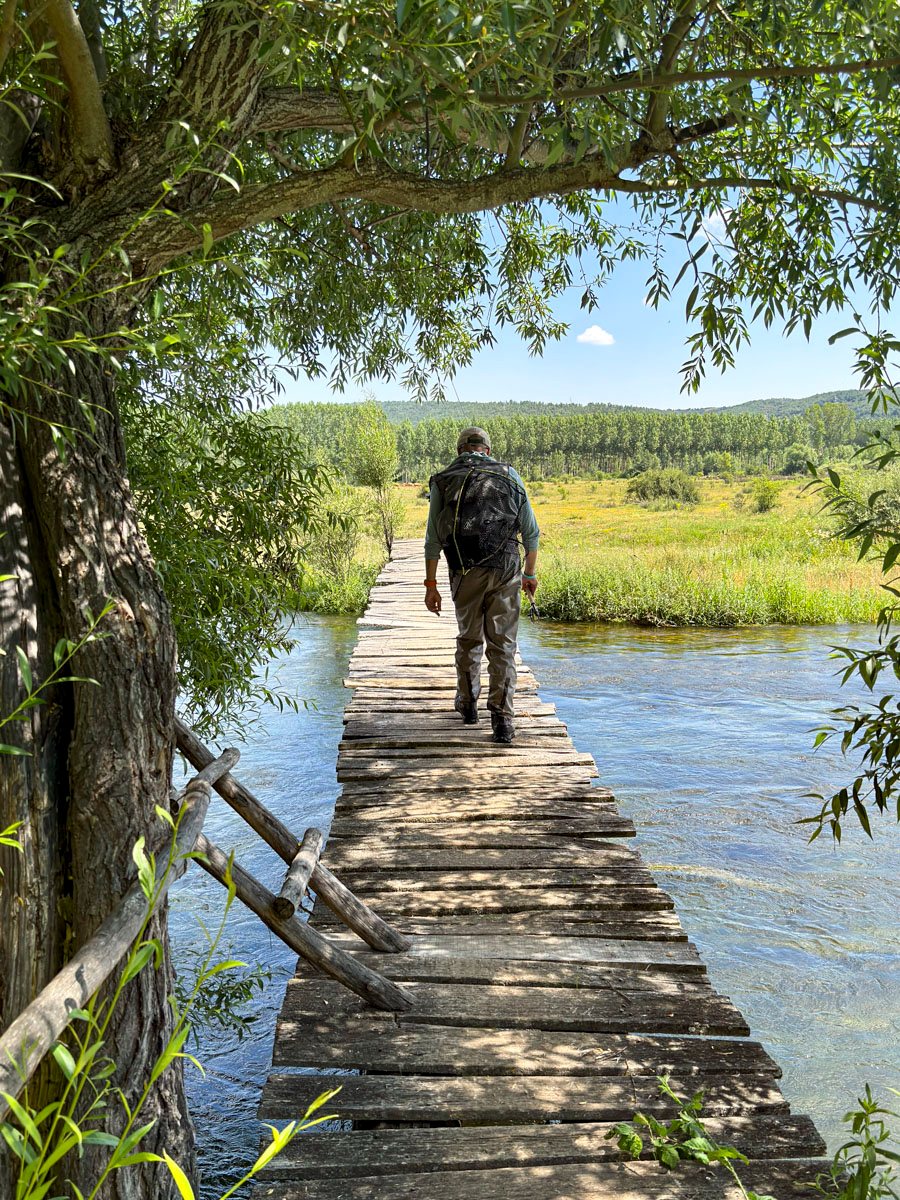 Wooden bridge over the river Luna